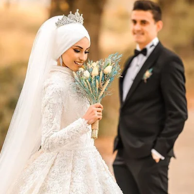 صور عروسة مع عريس بالفستان الابيض.