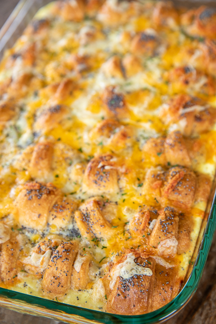 Ham & Cheese Crescent Breakfast Casserole - seriously the BEST!!! Crescent rolls, ham, cheese, brown sugar, Worcestershire sauce, cream cheese, dijon mustard, eggs, and milk. SO simple and SOOO delicious! Great for breakfast, brunch, lunch, dinner, and tailgating! Everyone LOVED this easy breakfast casserole. They cleaned their plates and asked for seconds. Success!!! #breakfast #casserole #ham #breakfastcasserole breakfast casserole in baking dish