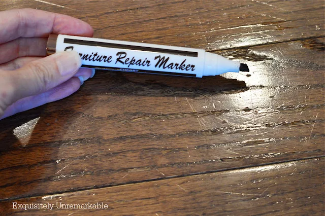 Furniture Repair Marker in hand