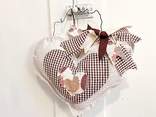 stuffed hearts with brown fabric and bow
