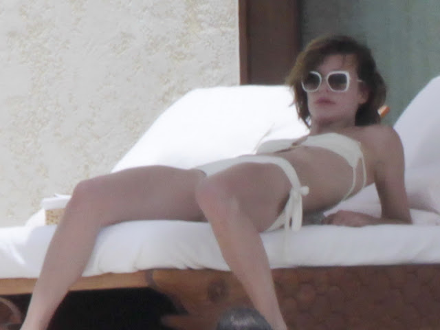 Milla Jovovich Hot Topless and Bikini in Los Cabos