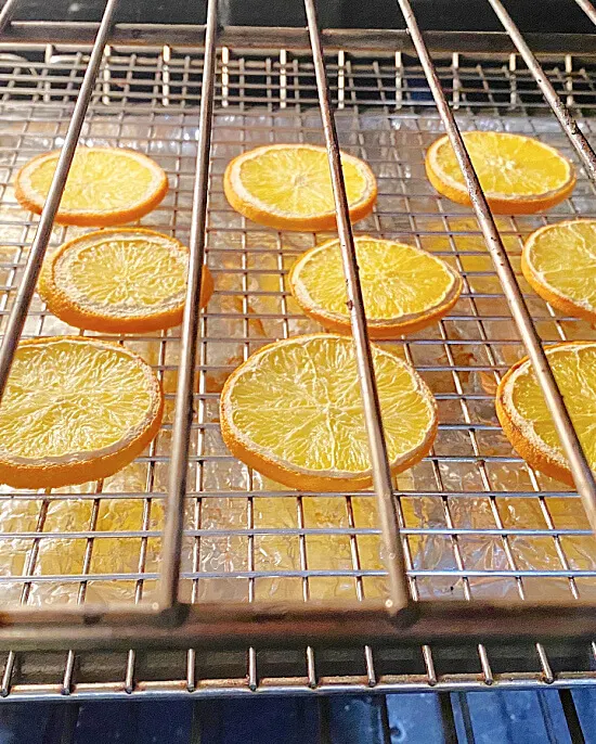 orange slices on a rack in the oven