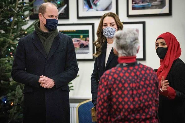 Kate Middleton wore a bianca coat by Hobbs, and faux pearl earrings by Simone Rocha, navy shoes by Emmy London. Metier Roma bag. Massimo Dutti