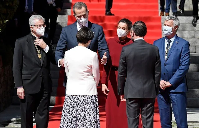 Queen Letizia wore a limited edition burgundy red open back dress from Massimo Dutti