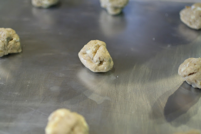 Lemon-cardamon white chocolate cookies dough on a tray