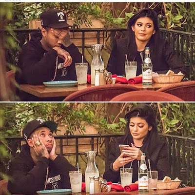 Tyga makes funny facial expressions while out with Kylie Jenner.