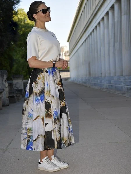 Crown Princess is wearing pleated printed silk midi skirt, and silk shirt half sleeve top at Ancient Agora Museum