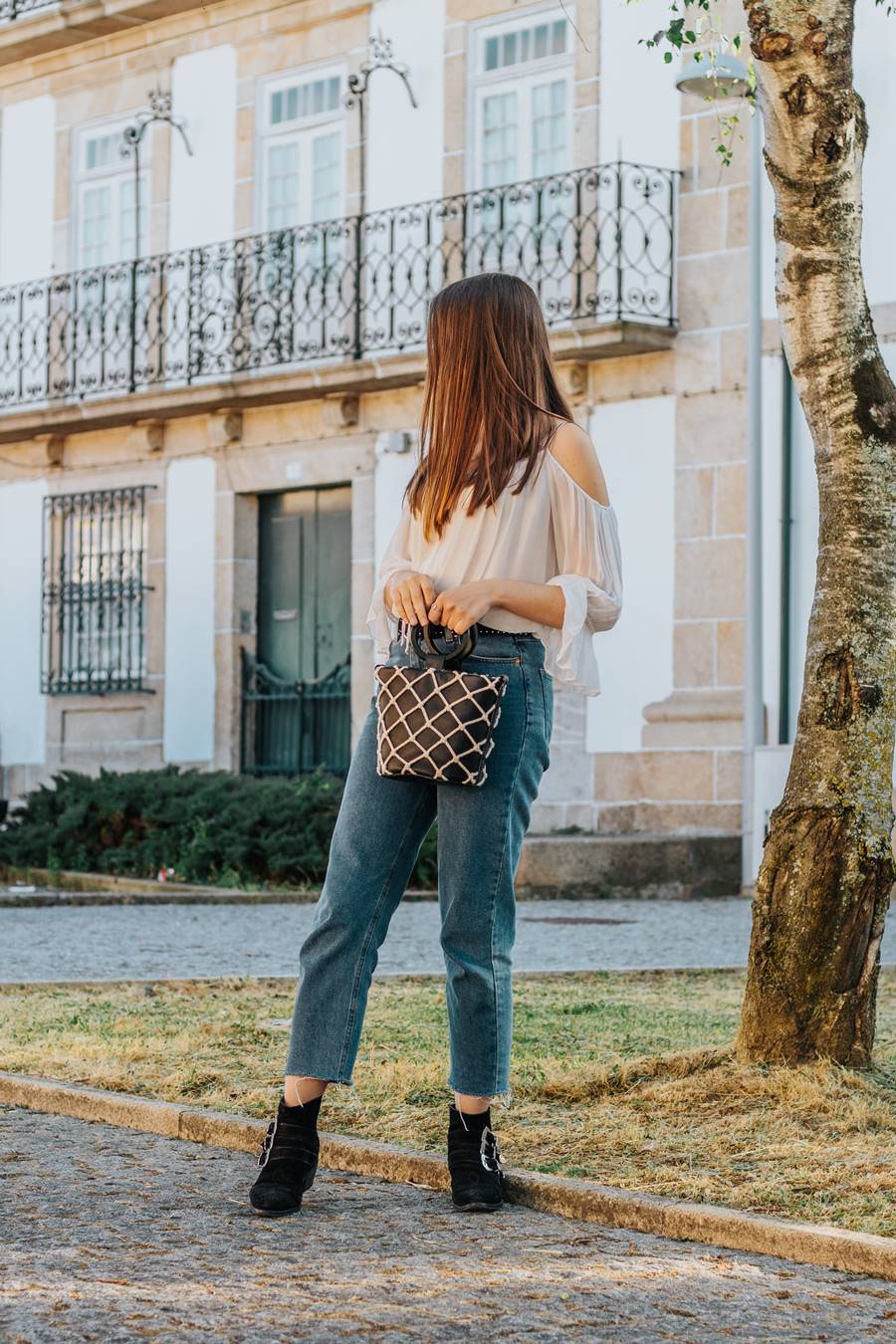 off shoulder shirt mom jeans ankle boots bucket bag outfit