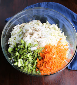 big bowl of shredded cabbage, onions, peppers, carrots and celery seed for coleslaw