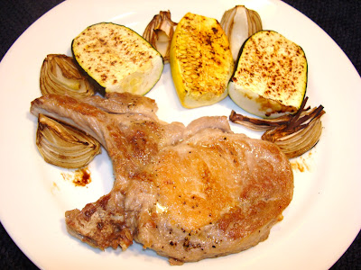 PORTIONS: 2 INGREDIENTS 2 Pork chops, 8 oz each 1 zucchini, cut in half length wise and half width 1 yellow squash, cut in ½ length wise and half width 2 medium size onions, cut in 4wedges each 1/4 tsp. paprika 1 tbsp. balsamic vinegar  Salt and pepper to taste PREPARATION In a cooking tray, place the zucchini,  yellow squash, and sprinkle with the paprika, salt and pepper. In same tray add onions and drizzle with the balsamic vinegar. Bake in oven at 400° F - 200° C for about 15 minutes. In the meantime, in a saute pan cook the pork chops with no oil, at medium heat. Brown both sides.