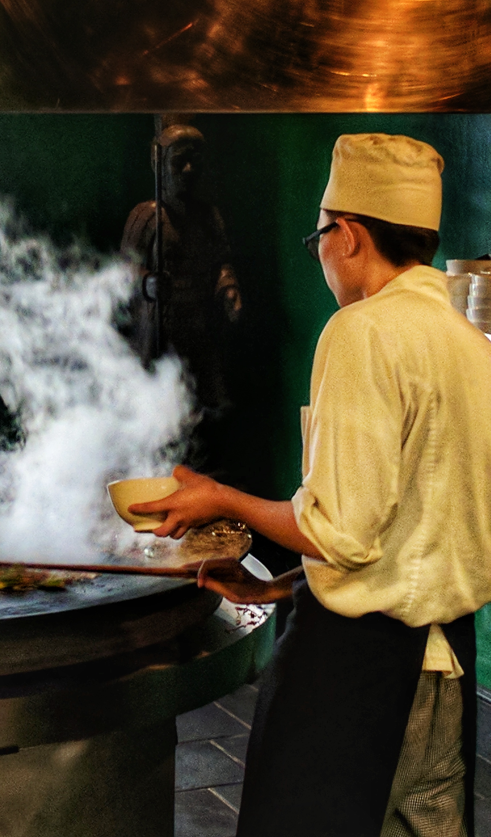 Chef cooking at an open Mongolian BBQ