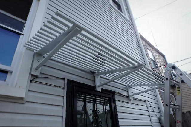 solid stained pressure treated wood awning slats