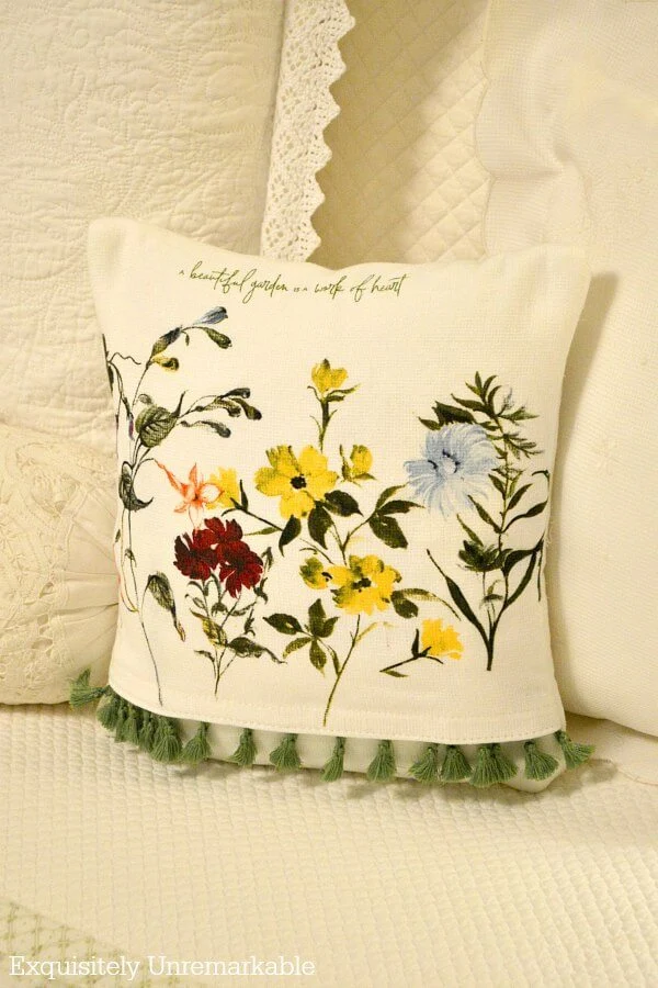 Fringed floral pillow cover made from a dish towel