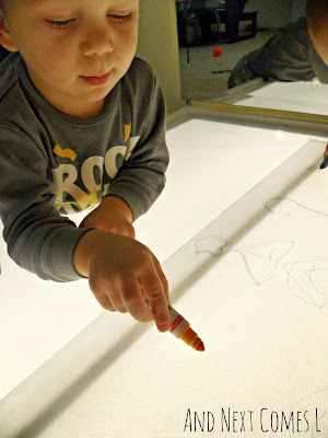 K doing some "writing" from And Next Comes L