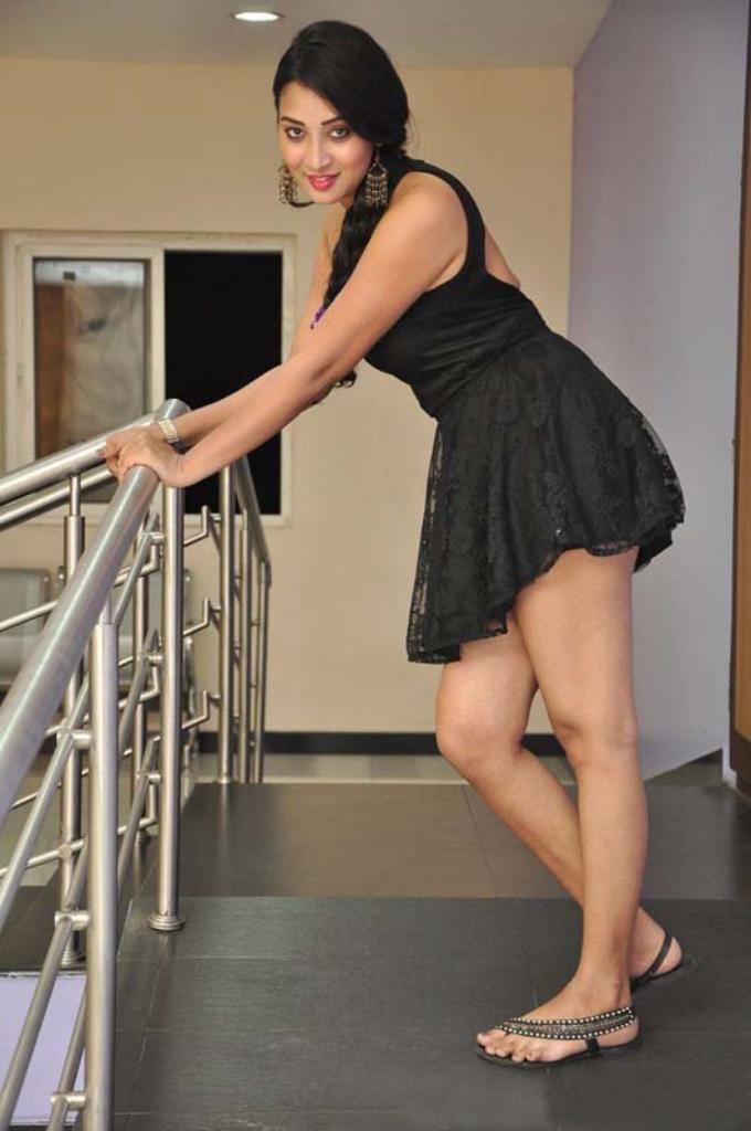 Glamorous South Indian TV Model Bhanu Sree Long Cross Legs Stills In