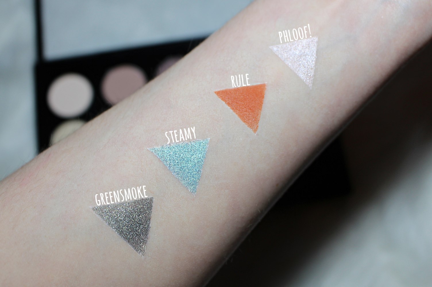 a close-up of mac cosmetics swatches on the light skin complexion