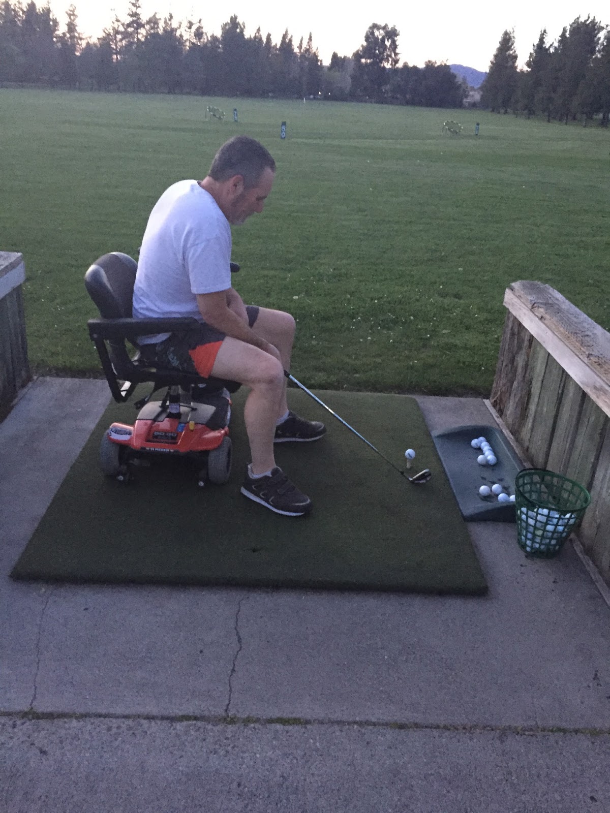 A half paralyzed wheelchair bound stroke survivor at a Golf Course