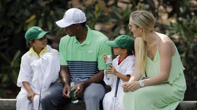 Lindsey Vonn sits with Tiger Woods and his children Sam and Charlie during the Par 3 contest at the Masters in 2015.Source:AP