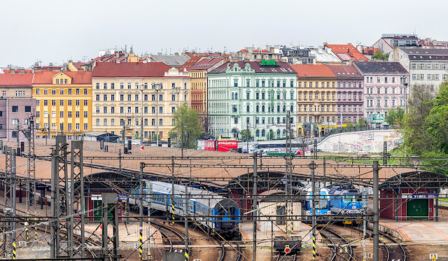 Colorful buildings stand behind Praha hl.n.
