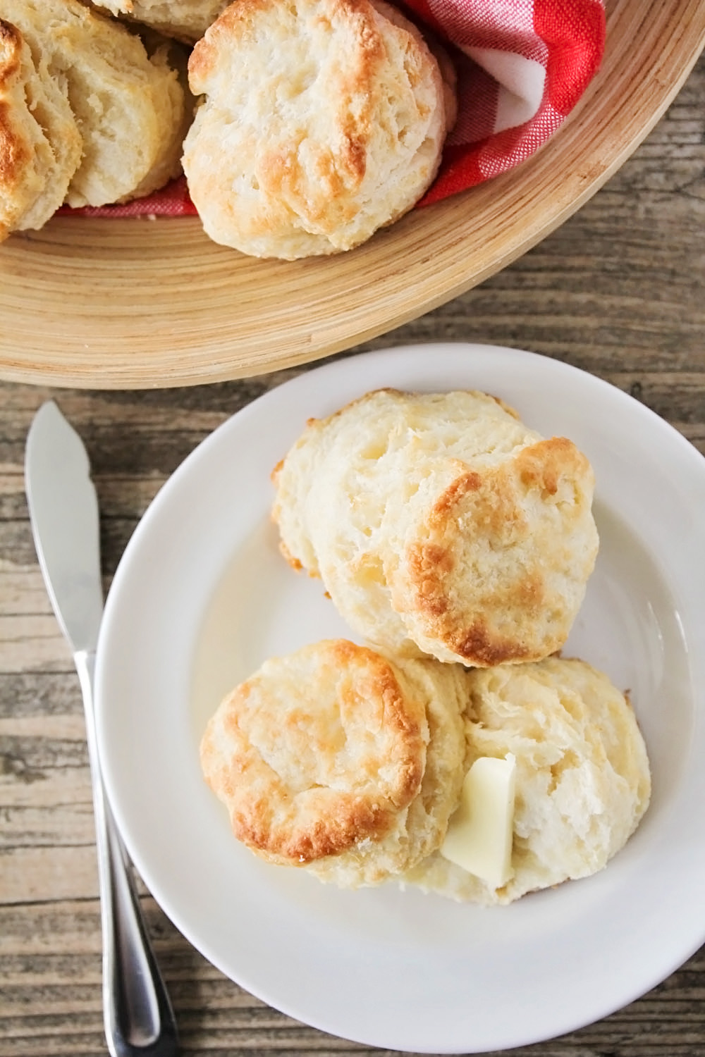 The best ever buttermilk biscuits - so light, fluffy, and melt-in-your-mouth tender. All the tips and tricks you need to make perfect biscuits every time!