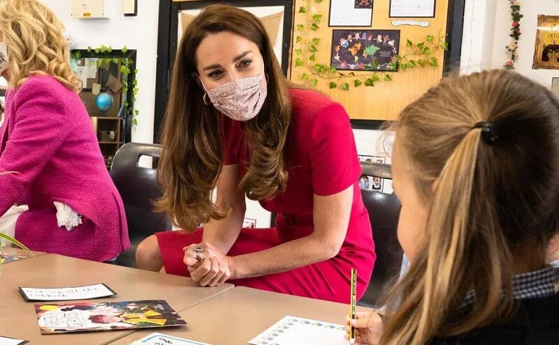 Kate Middleton wore a new midi pencil dress from Alexander McQueen. US First Lady Jill Biden wore a pink tweed blazer from L'agence