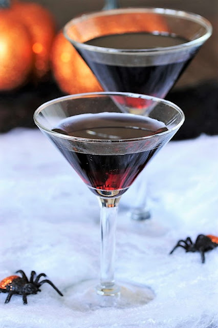 Black Vodka in Martini Glass to Make Spider's Kiss Cocktail Image