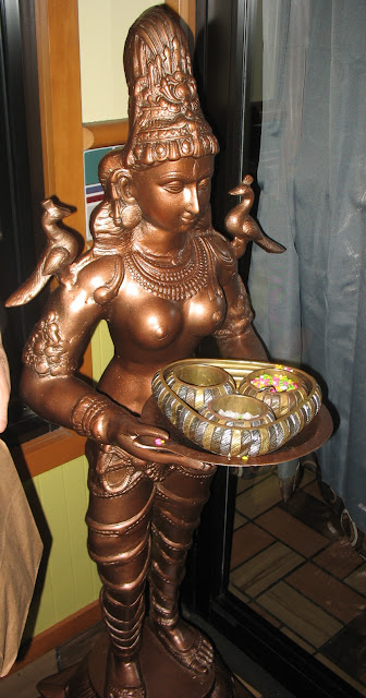 Indian Statuette offering candy