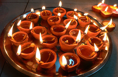 A tray full of litearthen diyas on the night of the Diwali pujan