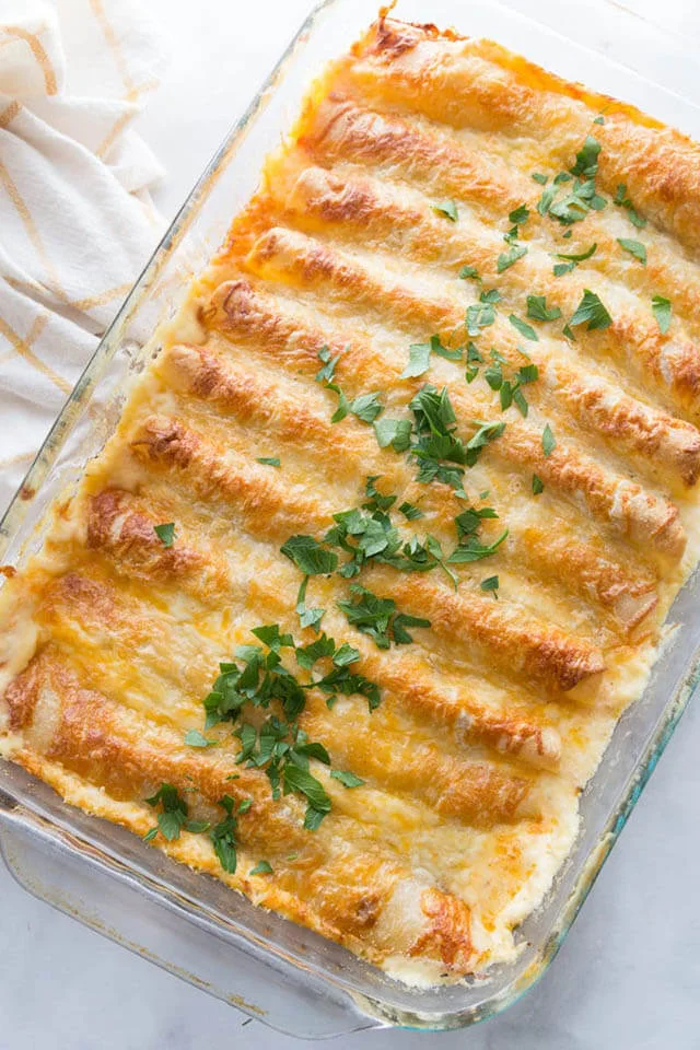Creamy White Chicken Enchiladas by Play Party Plan (Easy Recipe For Using Leftover Cooked Chicken)