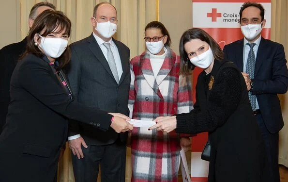 President of the Monaco Red Cross Prince Albert presented a check to Princess Stephanie