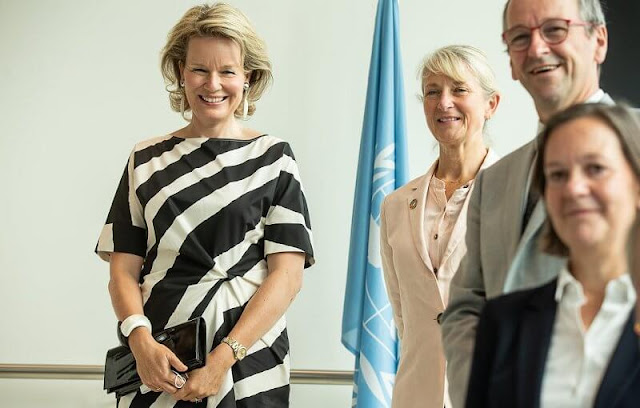 Queen Mathilde wore a black white stripe midi dress from spring summer 2021 collection of Natan