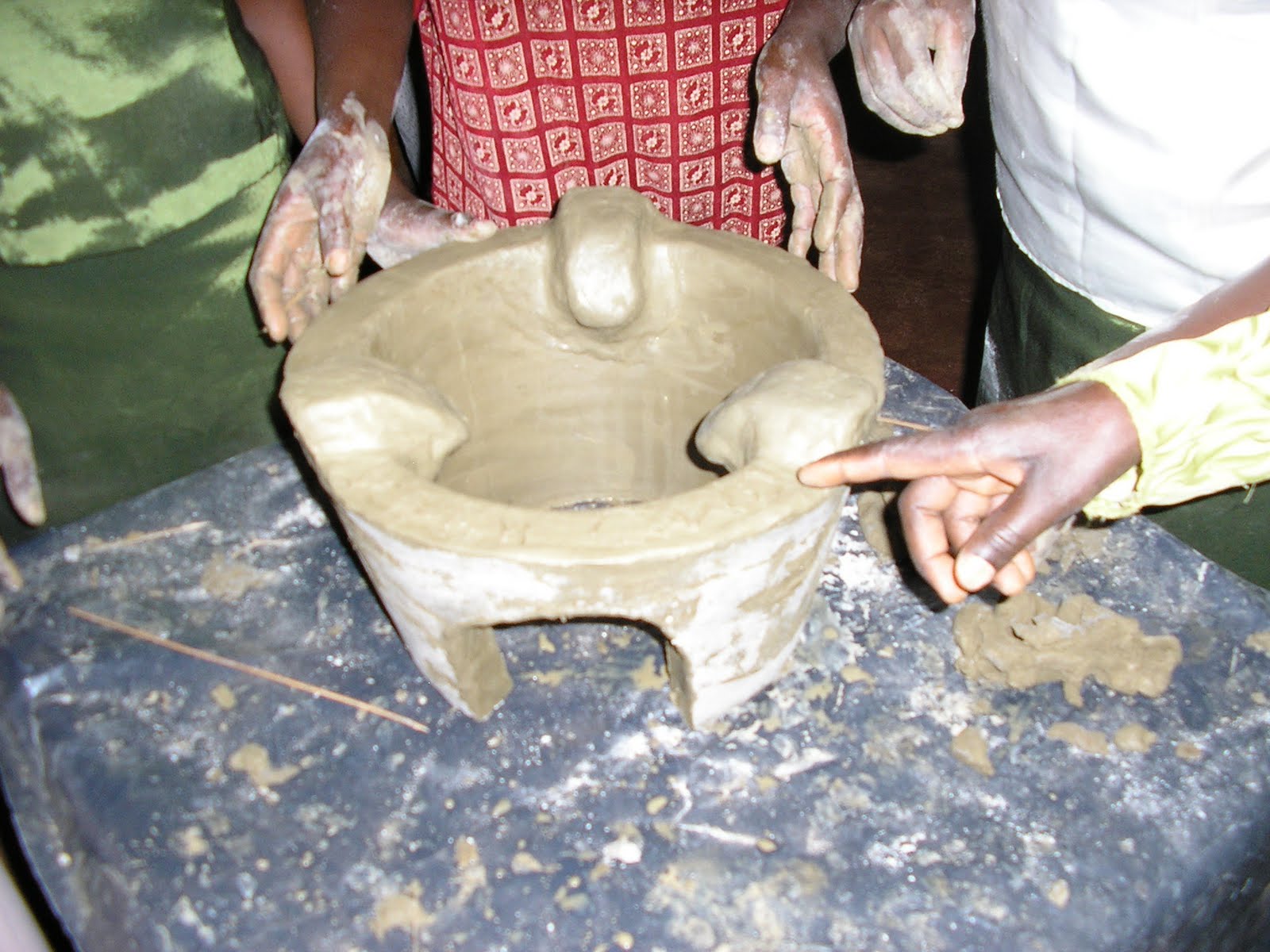 IcFEM Mission REAP improved clay cooking stove.
