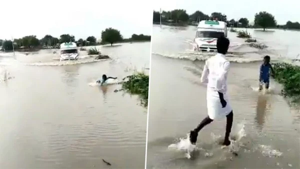  Karnataka, News, National, Video, Boy, River, Rain, Boy Risking His Life to Guide an Ambulance Through Flooded Bridge Over Krishna River on Devadurga
