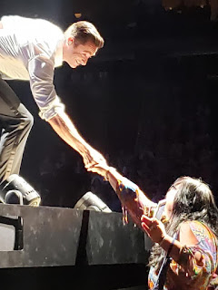 The Man. The Music. The Show.  Hugh Jackman shaking Sonomi Kennedy's hand. 
