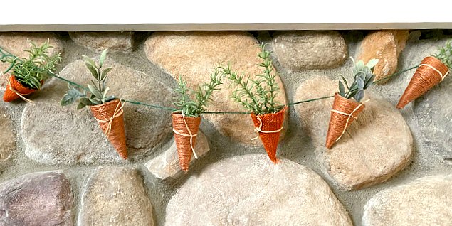Jute and burlap carrots hanging on the mantel
