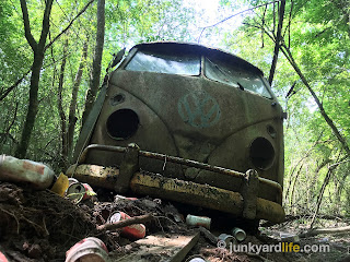 The split window bus' bumper guards and hollow headlight buckets make for a mean scary VW.