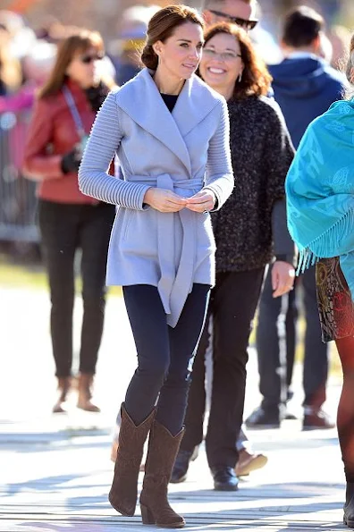 Kate Middleton wore a Ribbed Sleeves Wrapped Coat by Canadian designer Sentaler and new red coat by Venezeulan-American fashion designer Carolina Herrera, Tod's pumps