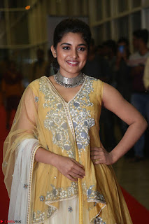Nivetha Thamos in bright yellow dress at Ninnu Kori pre release function ~  Exclusive (12)