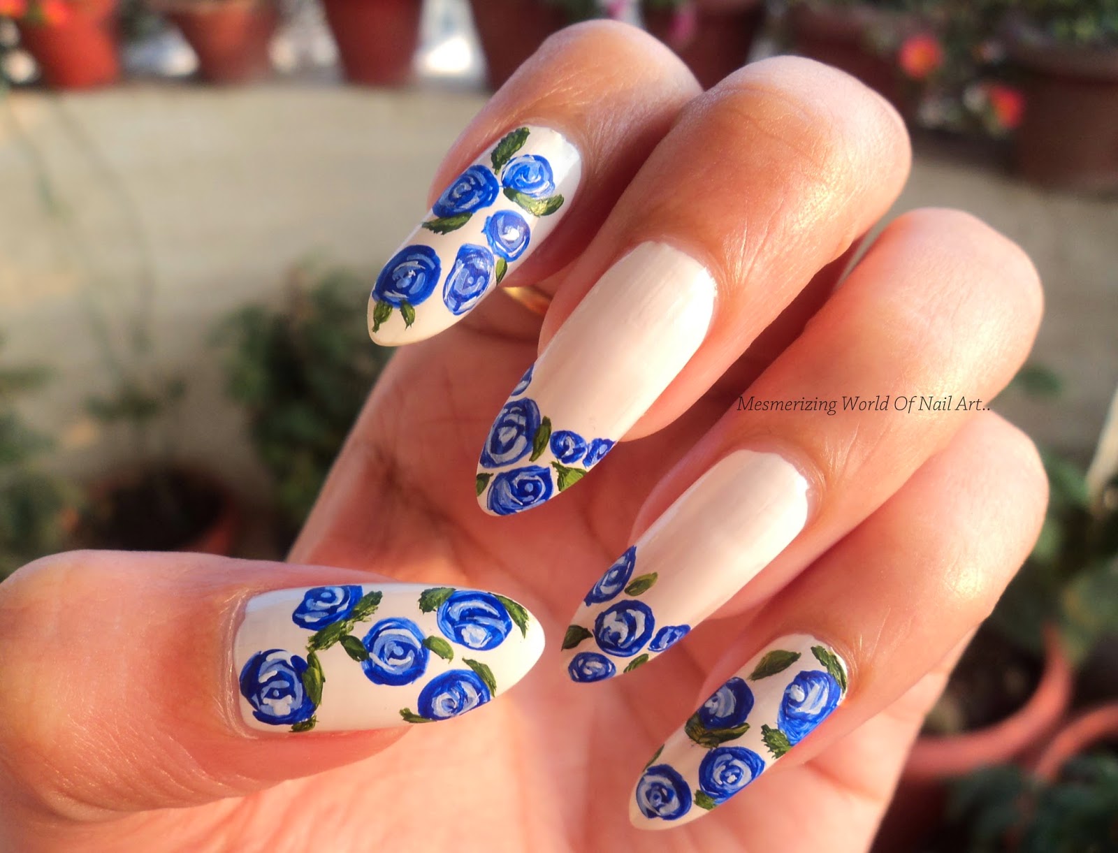 blue and black roses nail design
