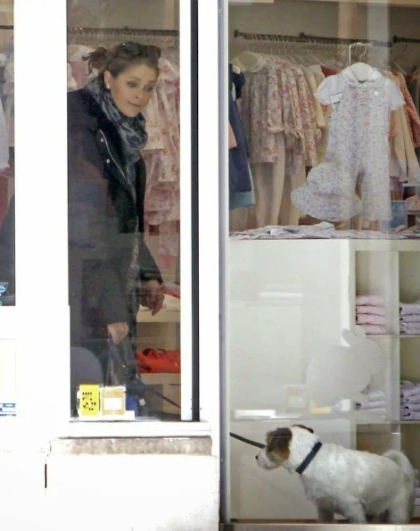 Princess Madeleine shops for her newborn daughter Leonore with dog Zorro.