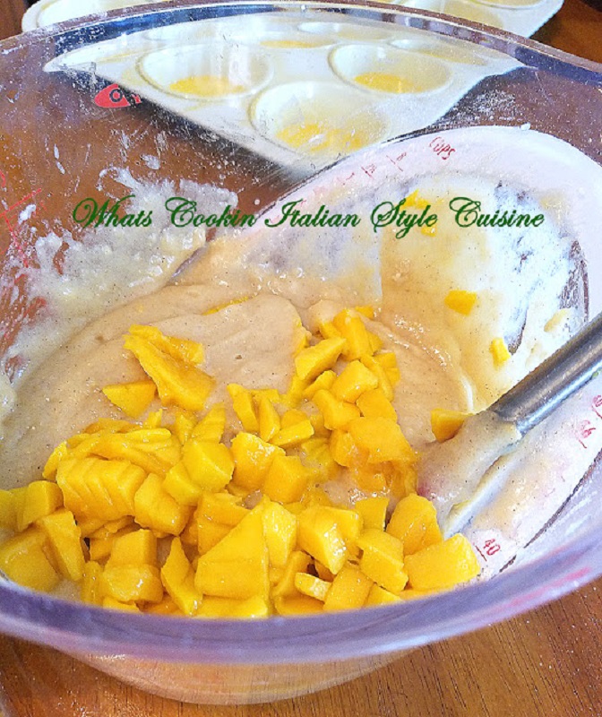 chopped mango in a bowl to make mango muffins