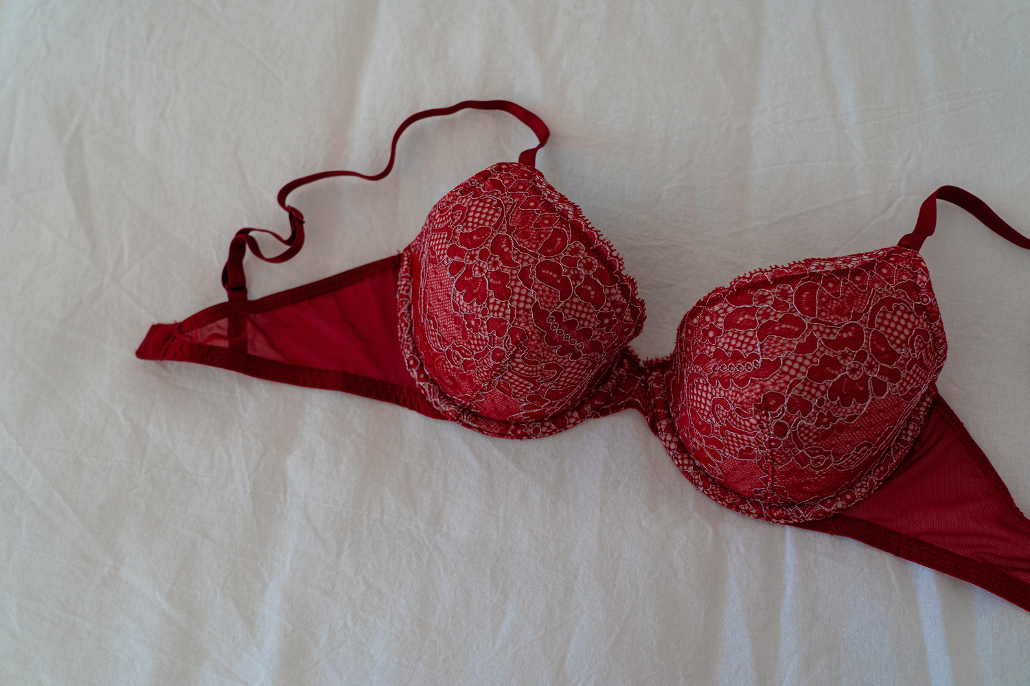 red bra on white bedding
