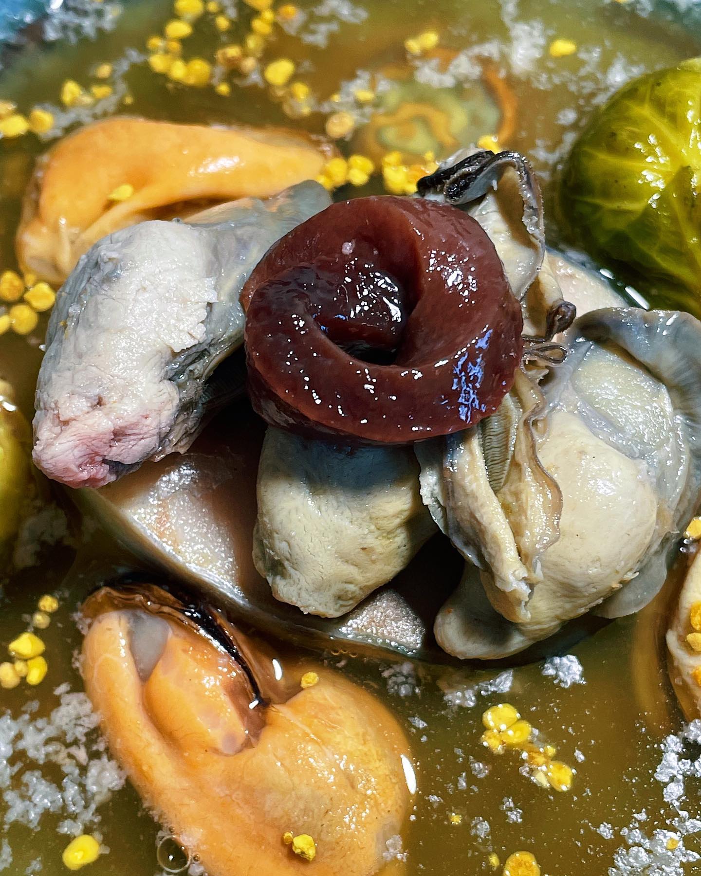 close up HD photo of steam oysters, raw beef liver rose, bee pollen, bone broth