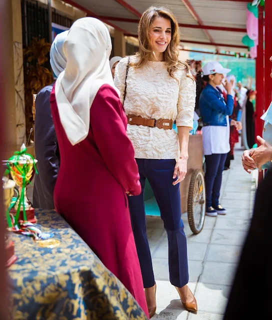 Queen Rania of Jordan visited the Safout Secondary School for Girls in connection with 70th anniversary of Jordan’s Independence Day and the 100th anniversary of the Great Arab Revolt. Queen Rania Style, Fendi dress, a bag