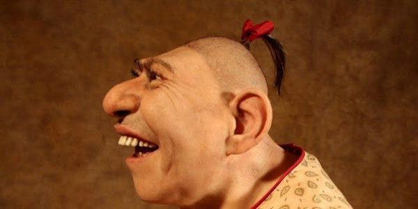 Why do pinheads have shaved heads? What age did Schlitzie die?