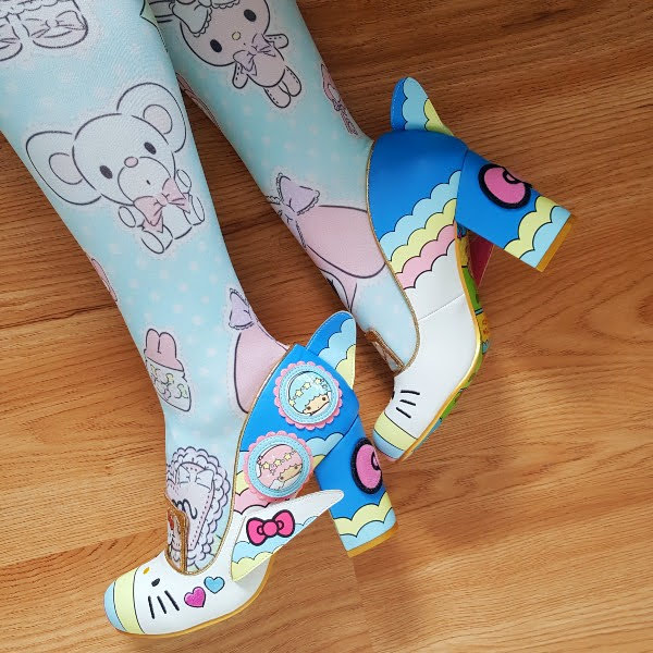 wearing pastel Sanrio print tights with Hello Kitty plane court shoes