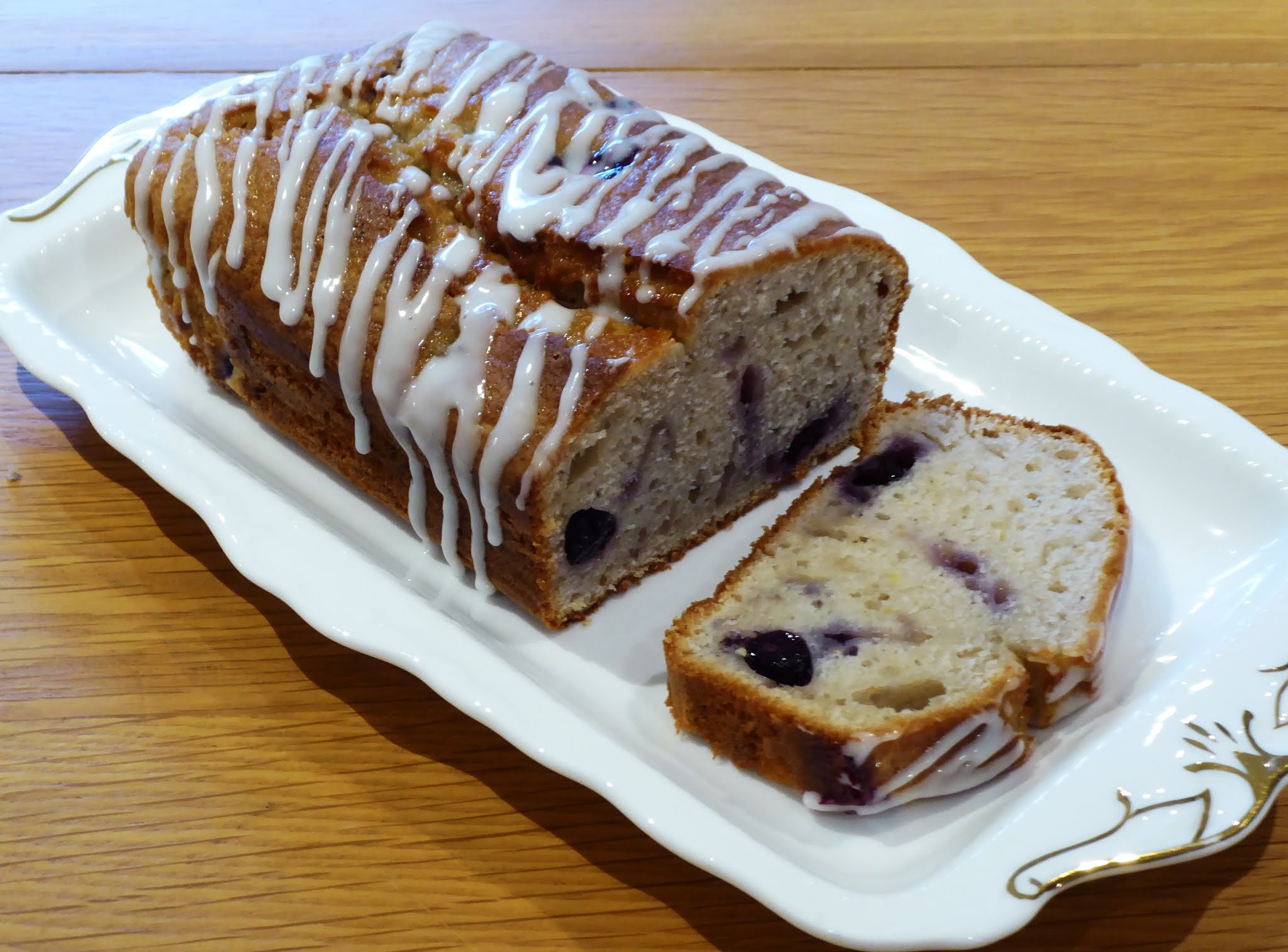 A SLICE OF CAKE BLUEBERRY AND LEMON YOGHURT CAKE