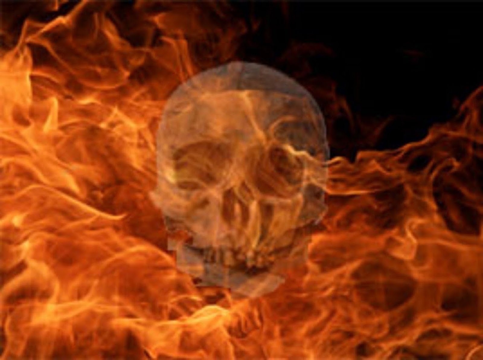 HUMAN SKULL IN THE FIRES OF HELL