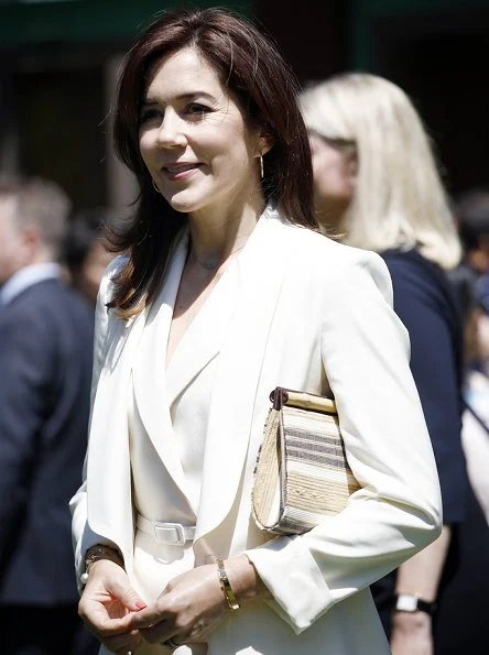 Crown Princess Mary is wearing an outfit by Max Mara. Princess wore Max Mara- silk panama jacket, and jumpsuit, trousers