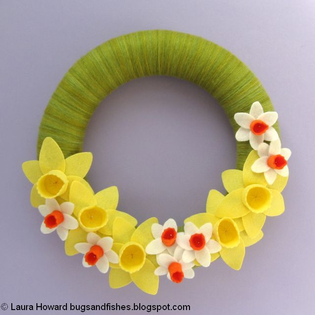 DIY March Daffodils Felt and Yarn Spring Wreath Tutorial adding the flowers to the spring wreath